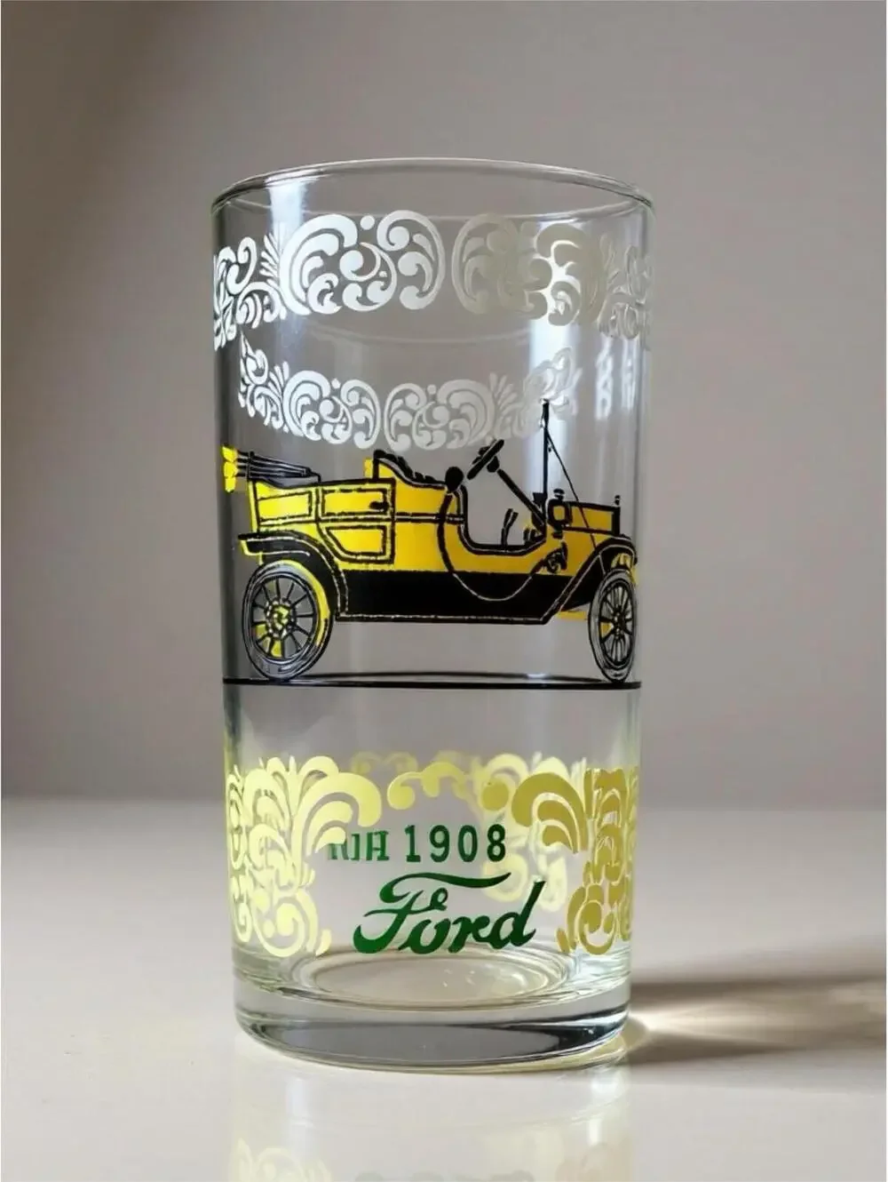 Vintage glass tumblers with early automobile designs 3